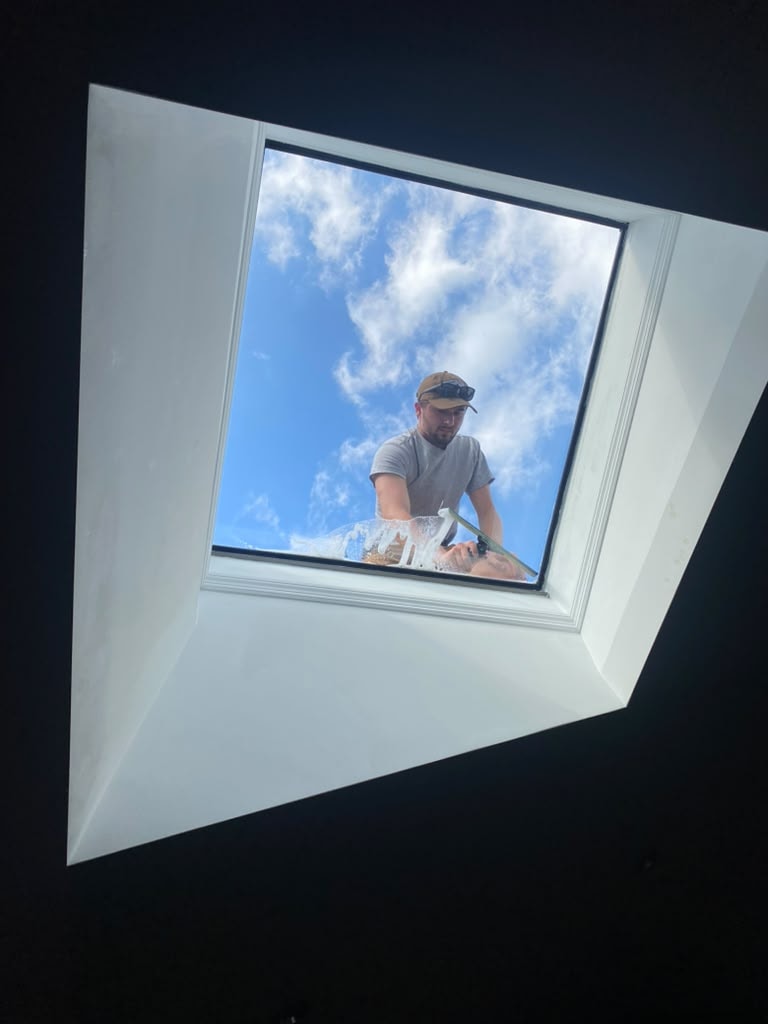 Professional window cleaner at work